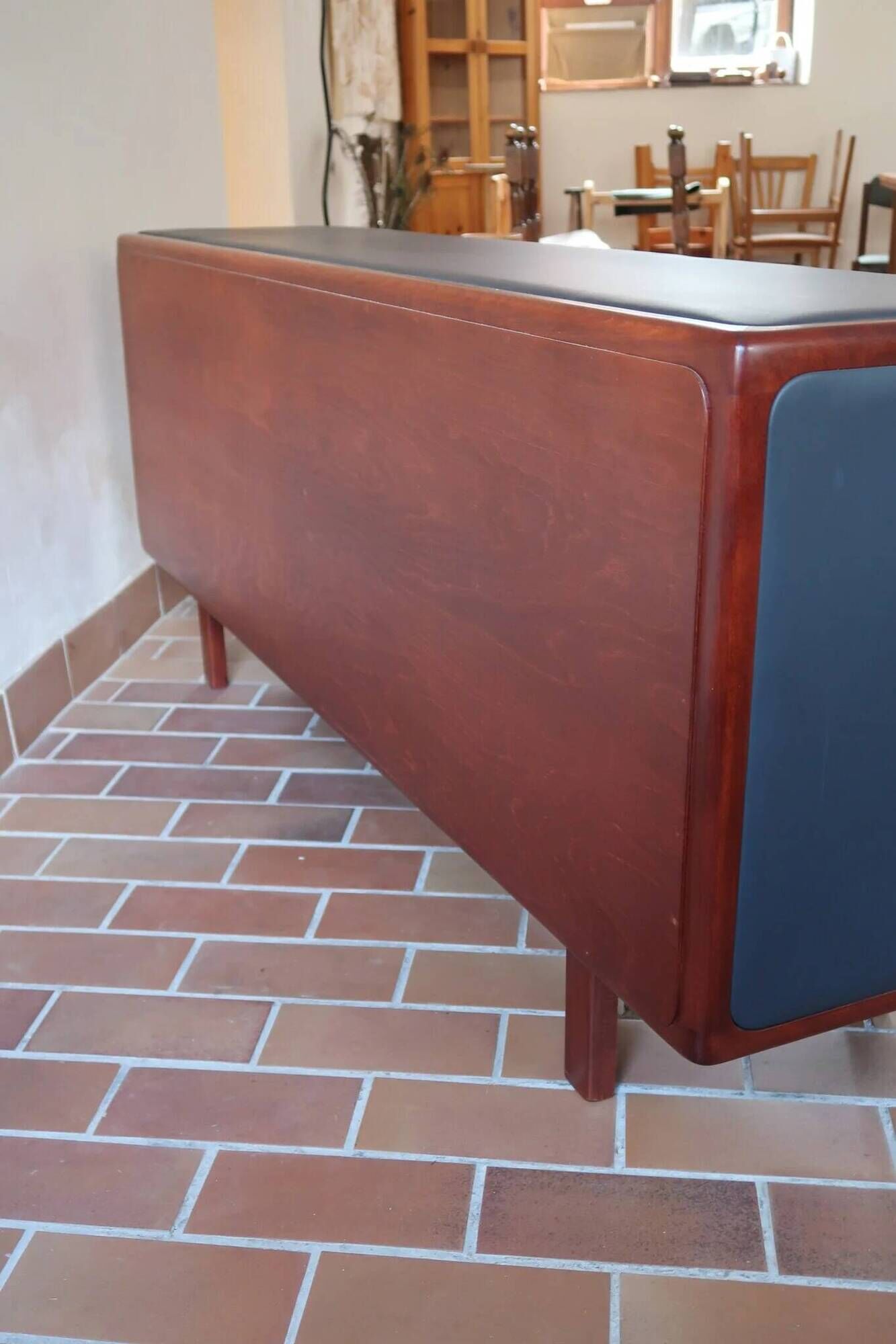 Teak enfilade, sliding doors, black faux leather top, 1970s.