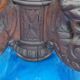 Round table in molded and carved oak with quill decoration, central shaft with 4 runners