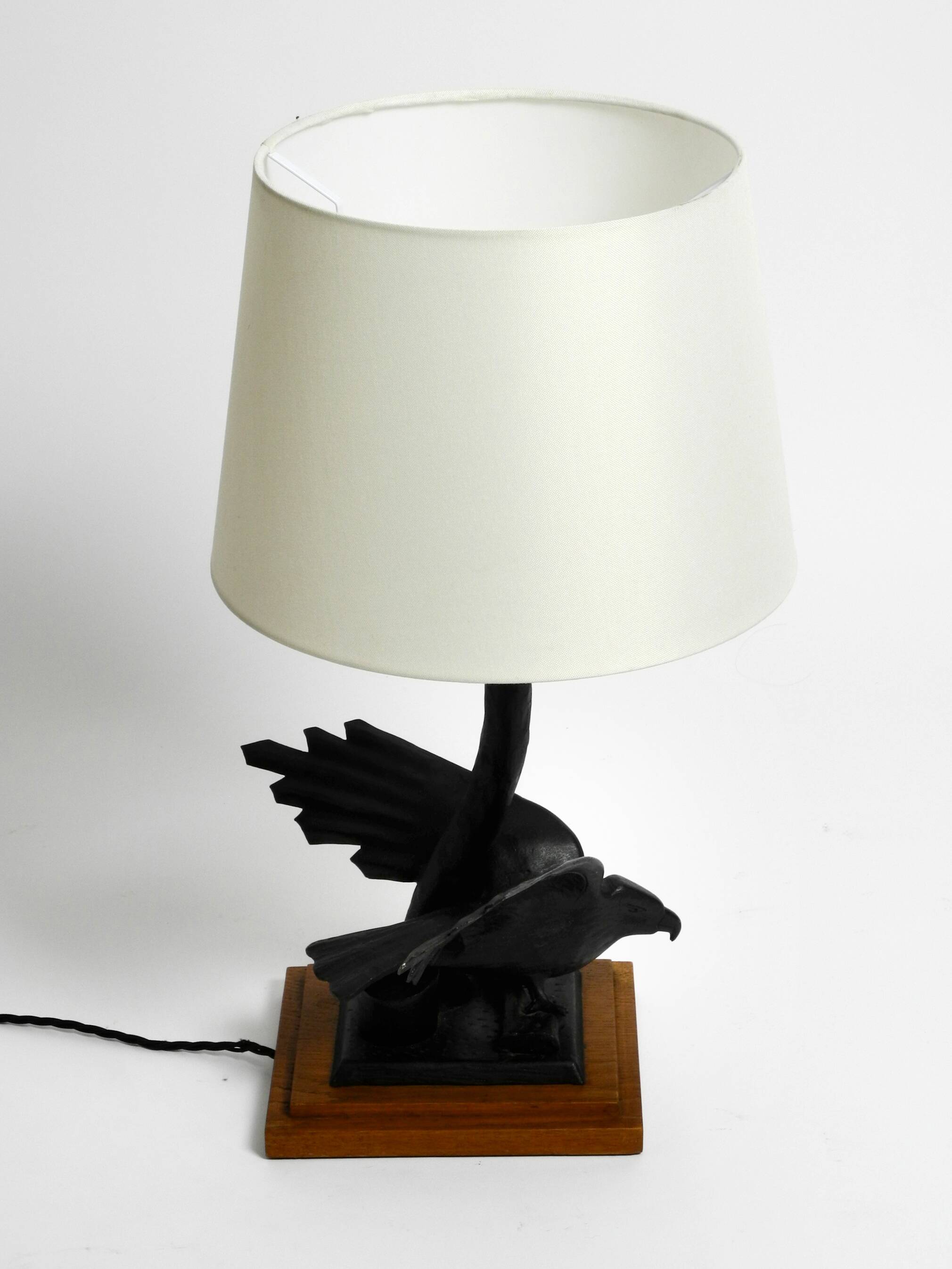 1940s table lamp made of iron in the shape of an eagle, teak wooden base