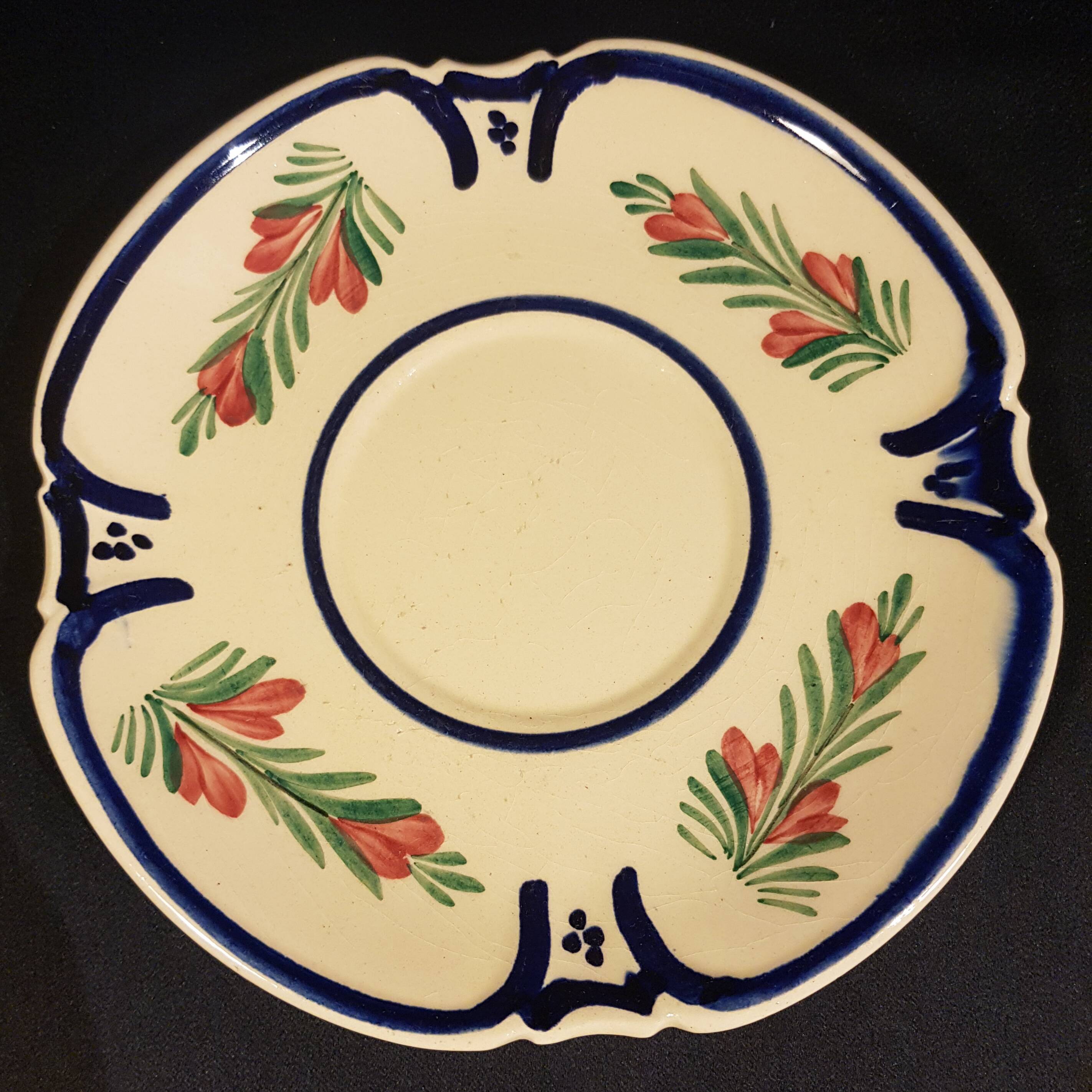 4 Quimper earthenware saucers or plates