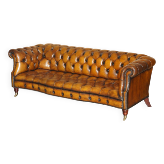 Vintage Chesterfield serpentine luxury sofa in restored leather