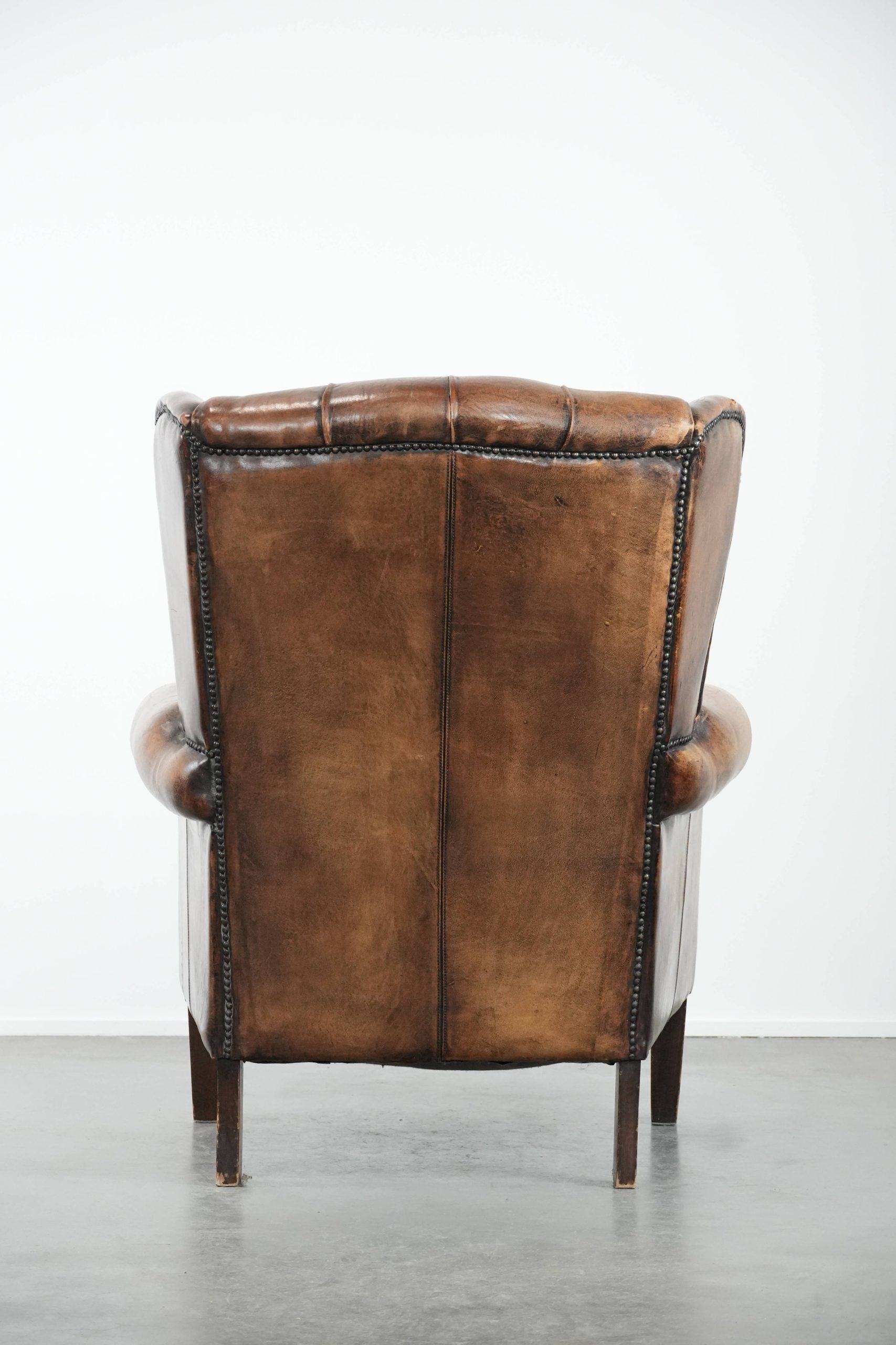 Unique large sheepskin Chesterfield wingback armchair in English style