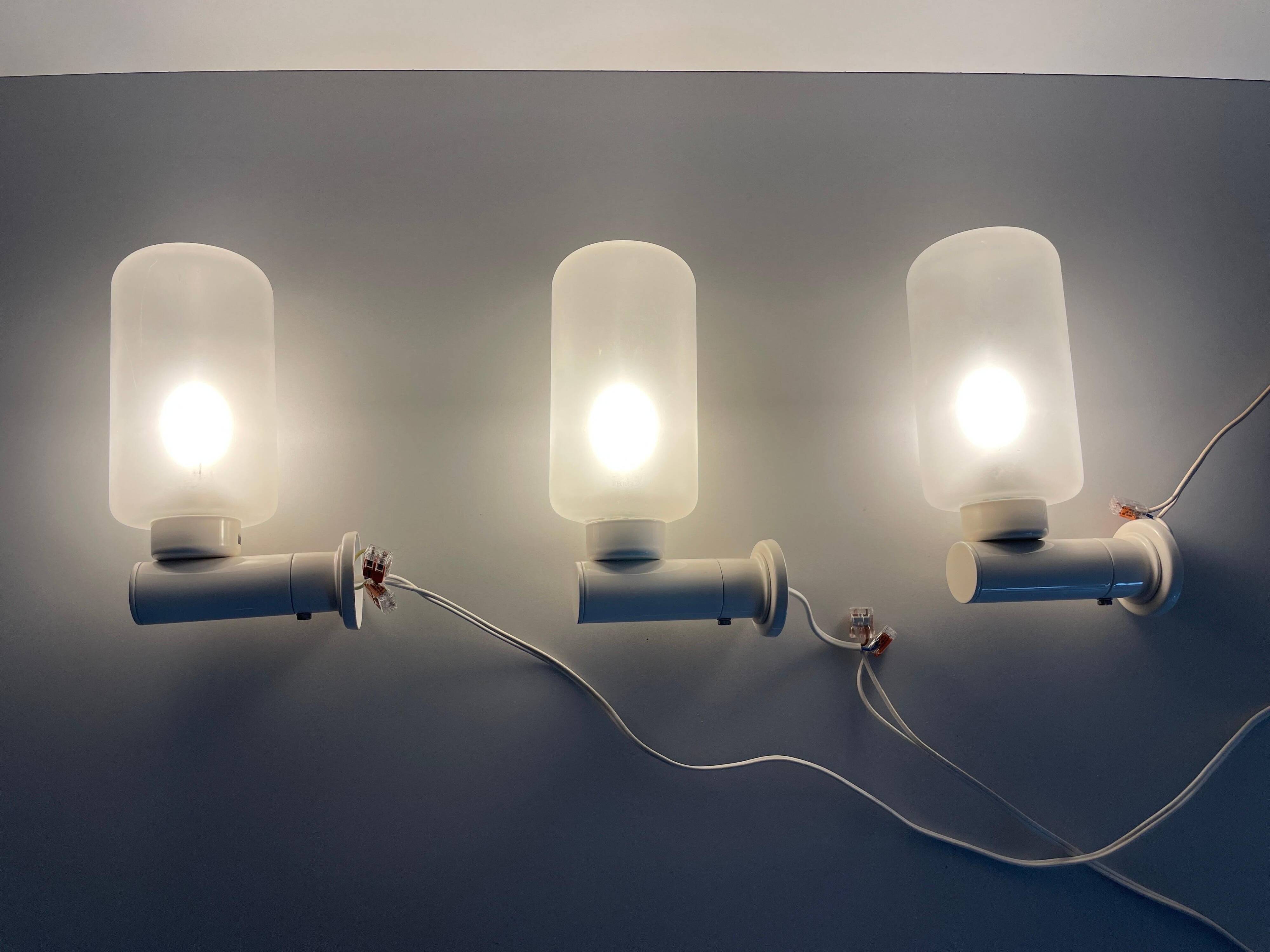 Set of 3 semi-transparent glass and white metal wall lights, 1960, Germany
