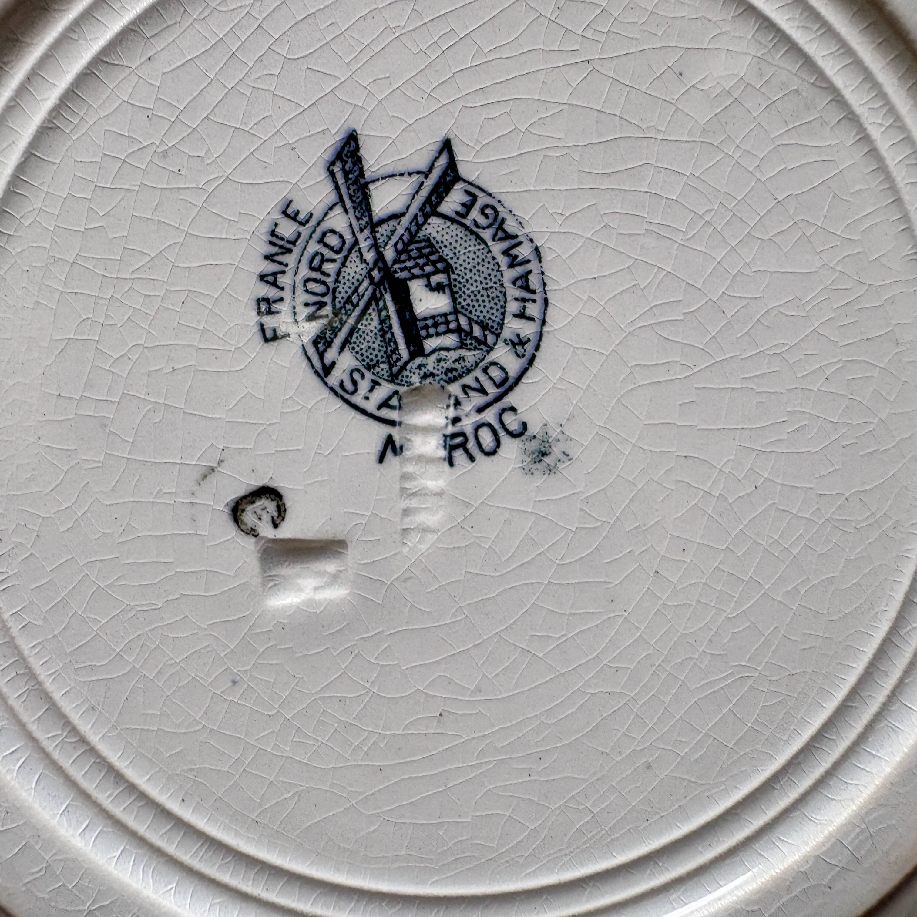 Set of 8 mismatched antique ironstone deep plates.