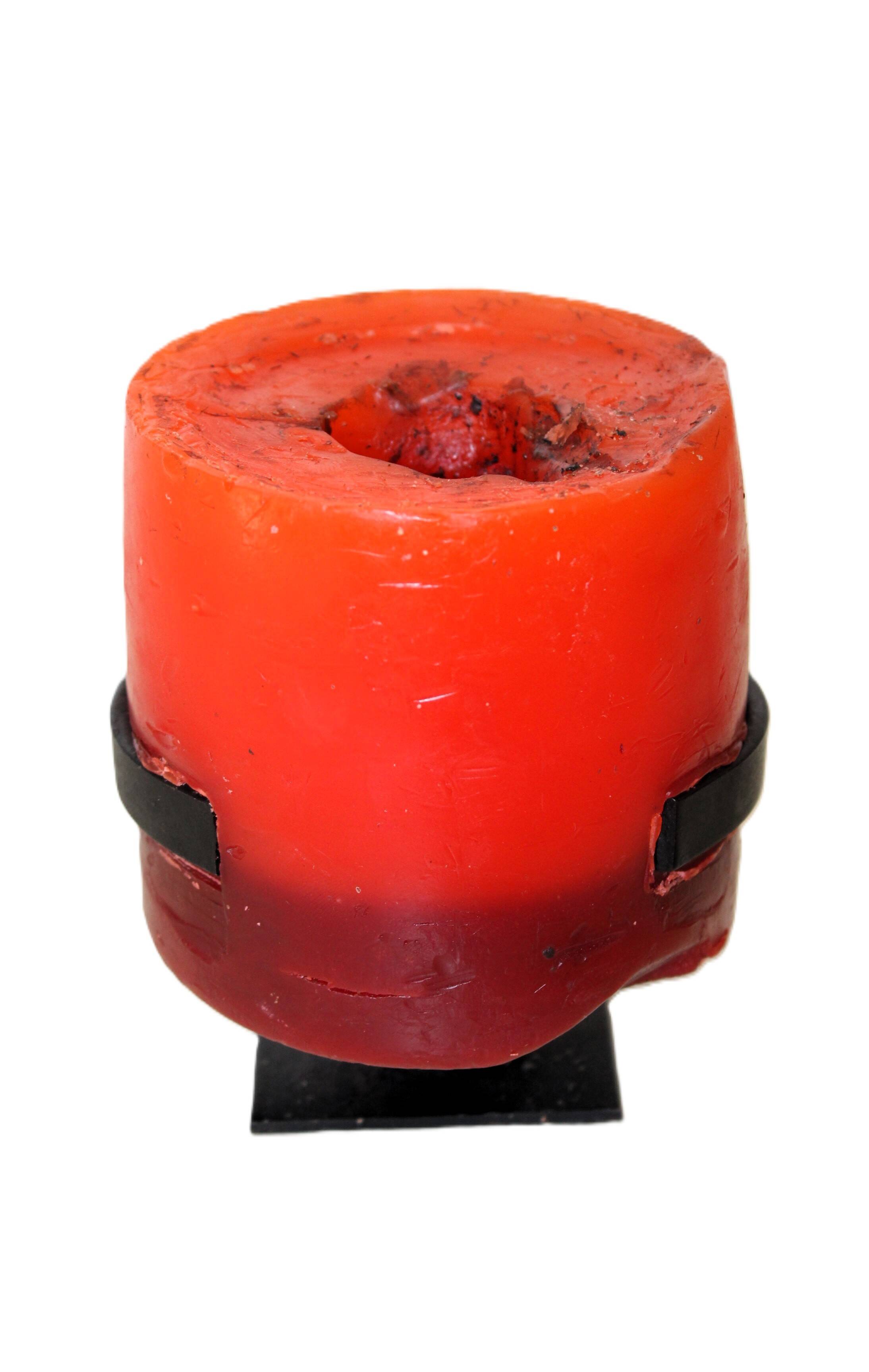 1970 wrought iron candlestick with its period coloured candle.