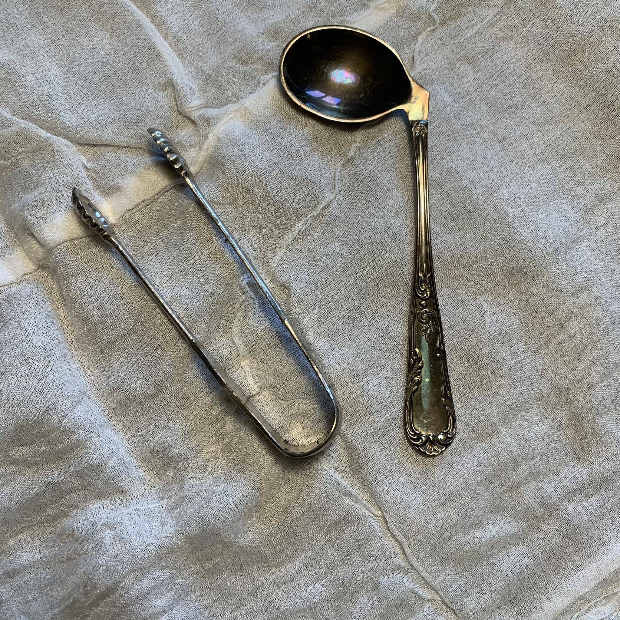 Set of a baby spoon and a sugar tongs
