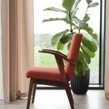 Vintage orange curly papaya armchair 1970