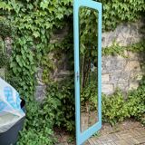 Beveled mirror on turquoise Parisian door