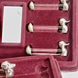 12 silver-plated metal duck knife rests with crystal.