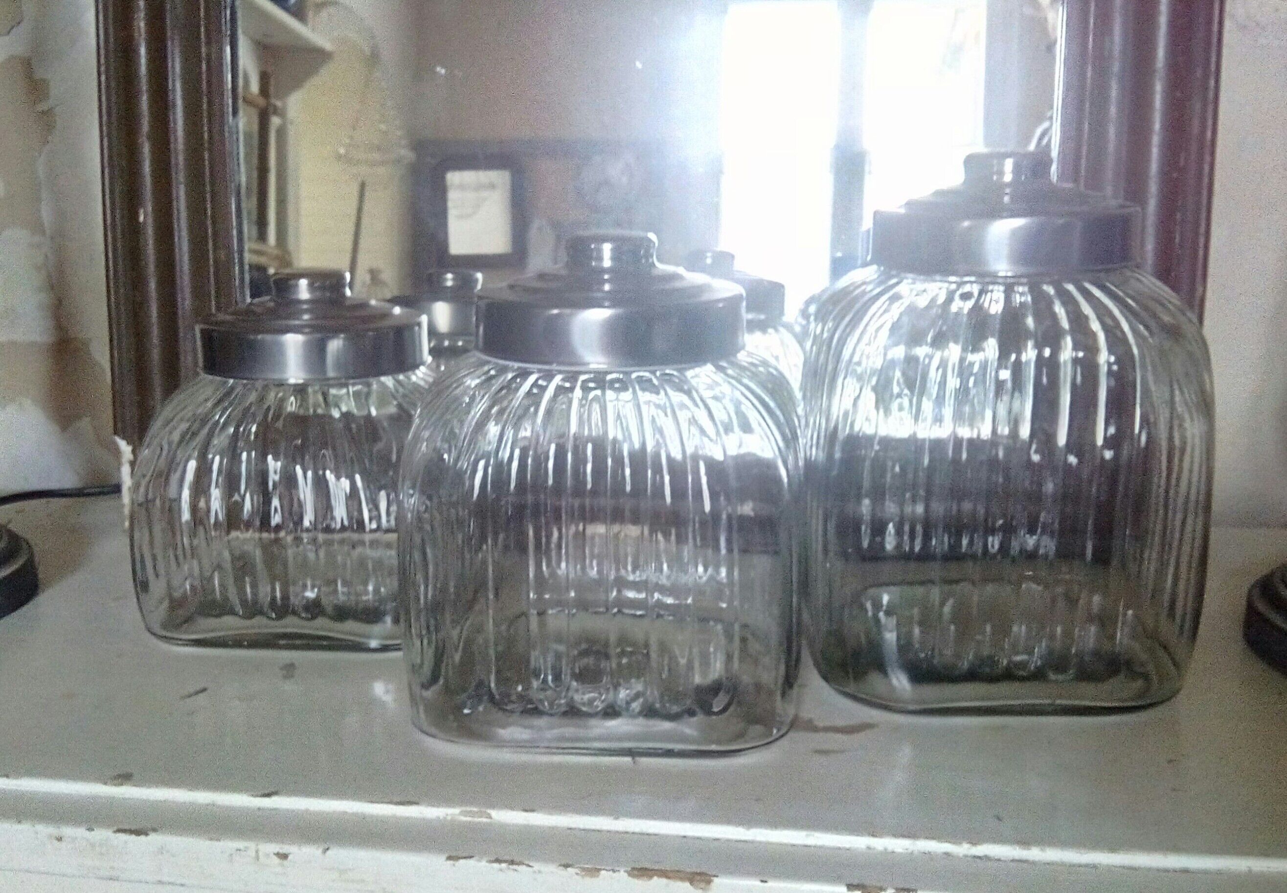 three large glass jars