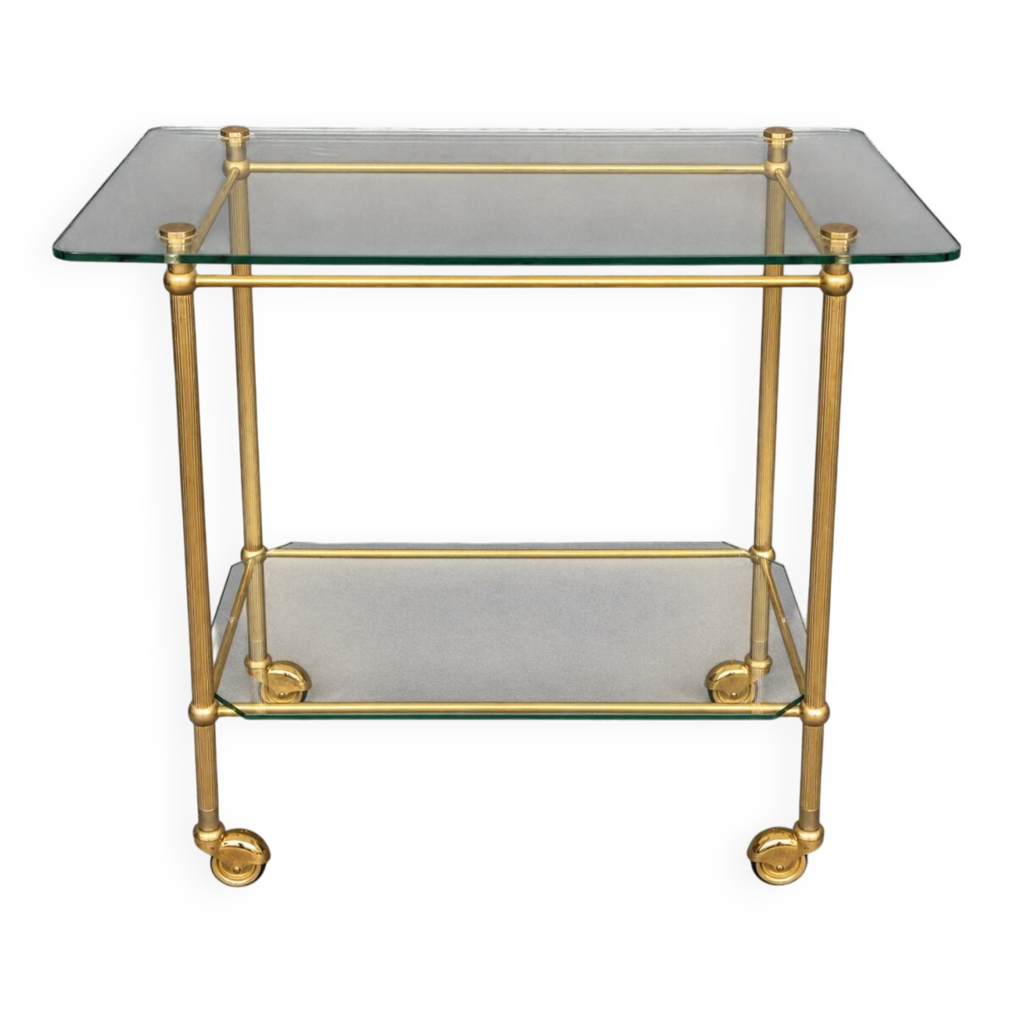 Service trolley on wheels with two glass shelves and a brass frame.