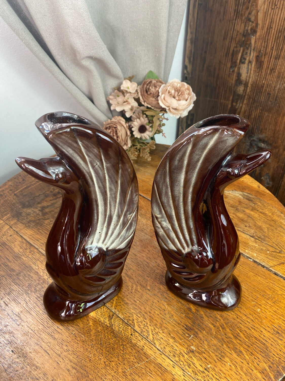 Pair of ceramic vases in the shape of swans.