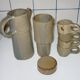 High coffee or teapot and 4 cups in sandstone