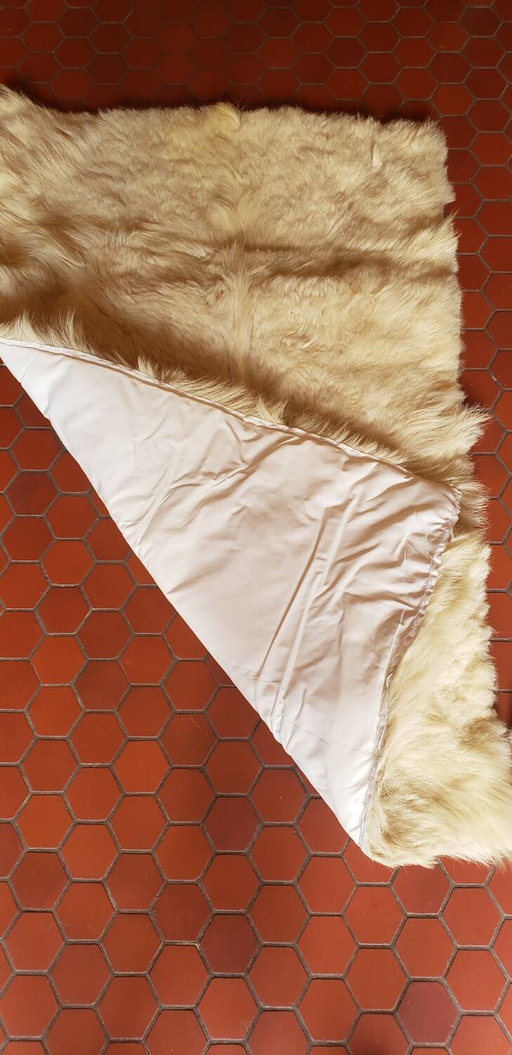 Beige goatskin rug in pair