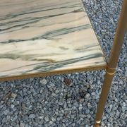Pair of neoclassical side tables in bronze, brass, marble, and o.