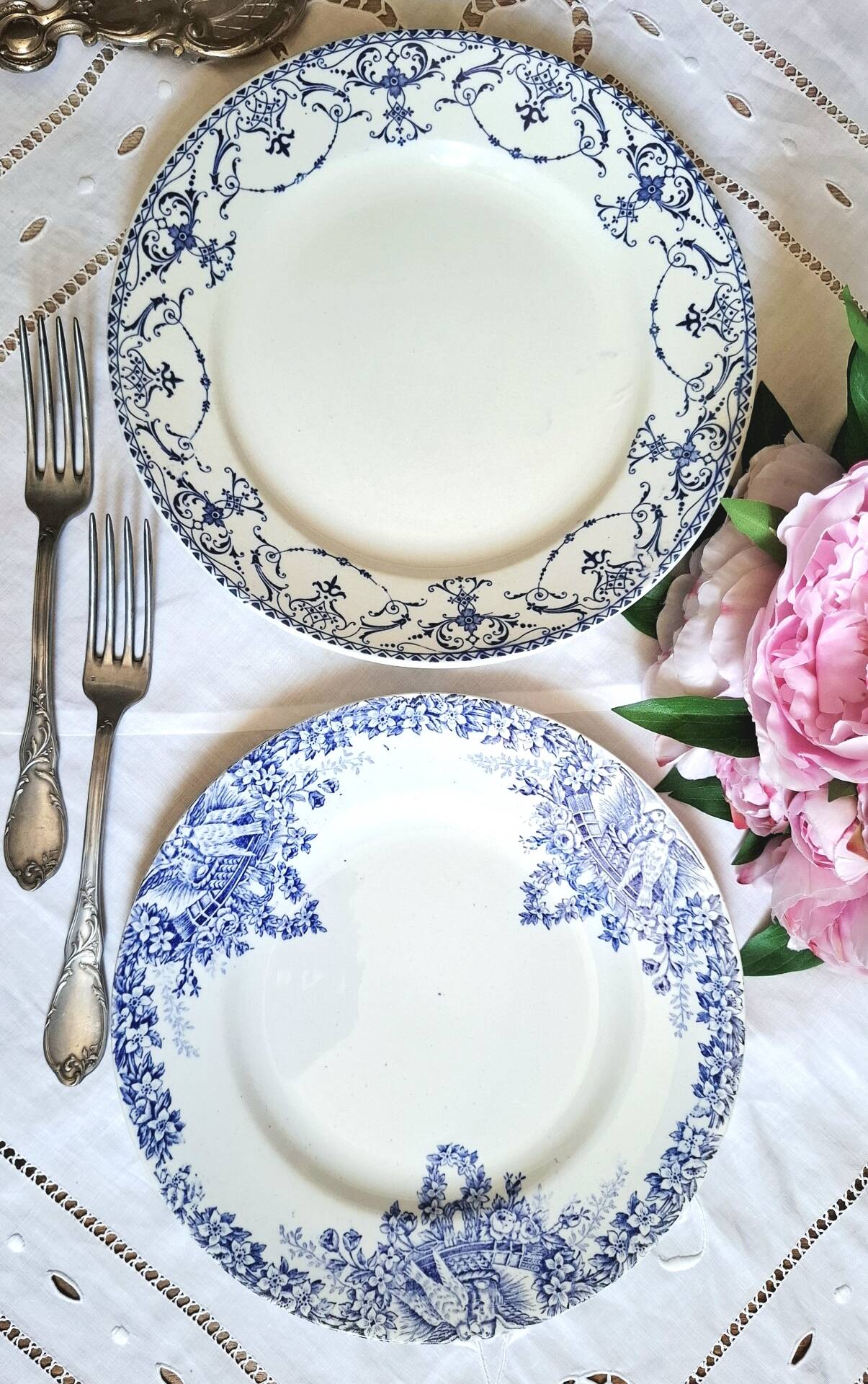 Old mismatched flat plates made of ironstone earthenware.