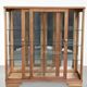 Antique Dutch oak display cabinet with glass shelves and a mirrored back