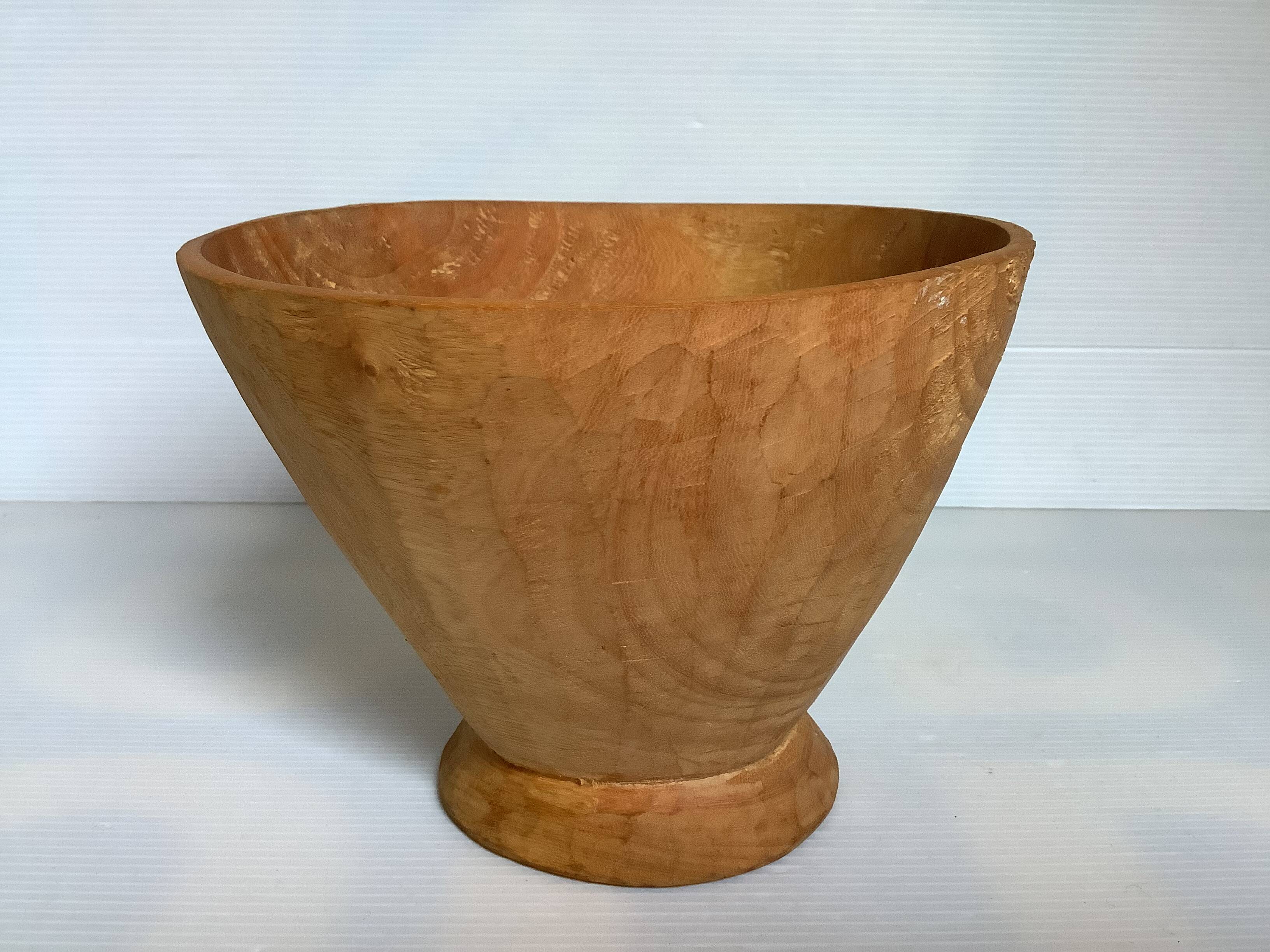 Asymmetrical wooden sculpted catchall.