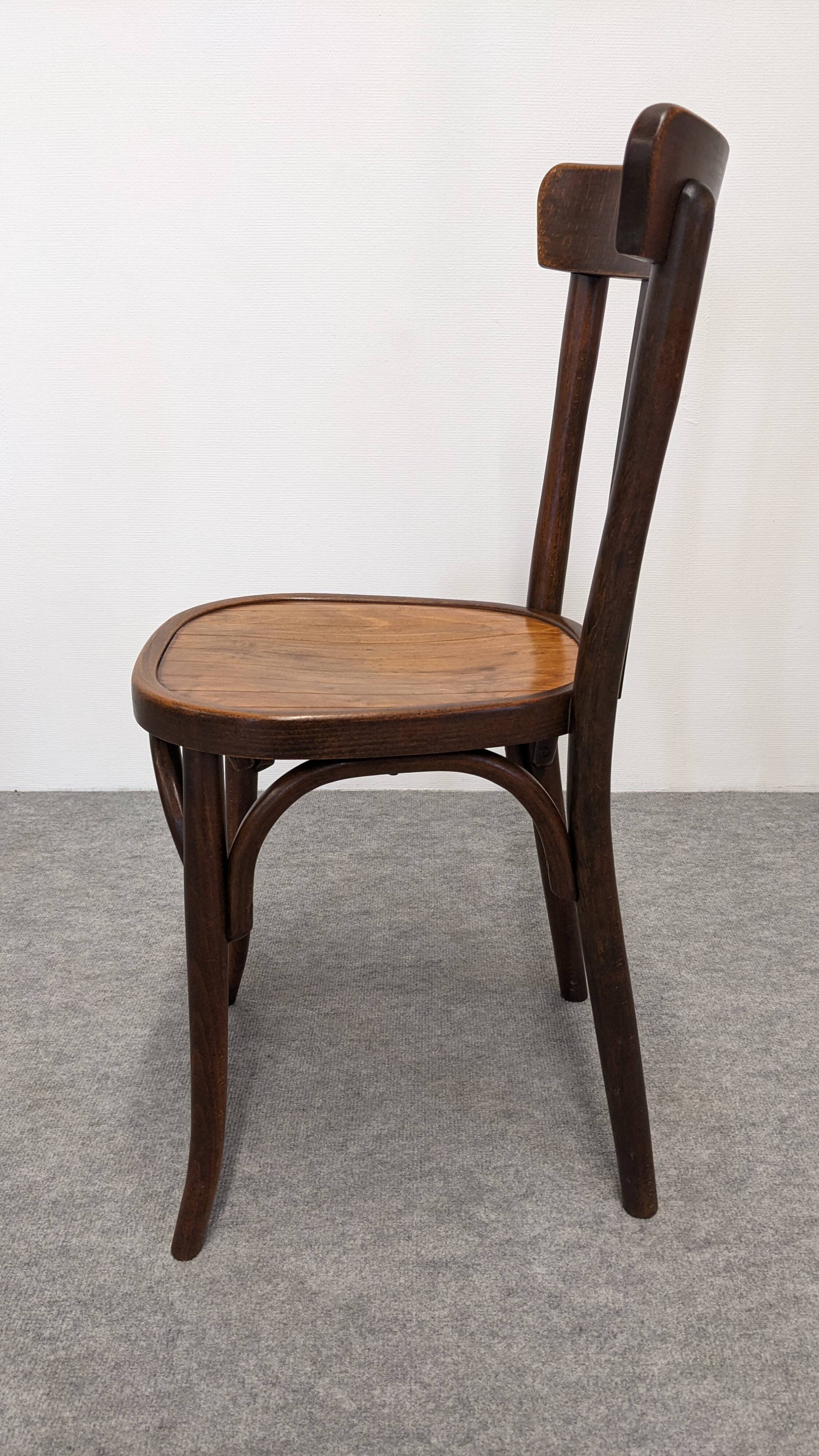 Set of 13 Baumann bistro chairs in bent beech, France circa 1930.