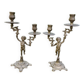 Paire de chandeliers chérubins en laiton
