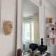 Wall sculpture of the face of the Venus de Milo in plaster.