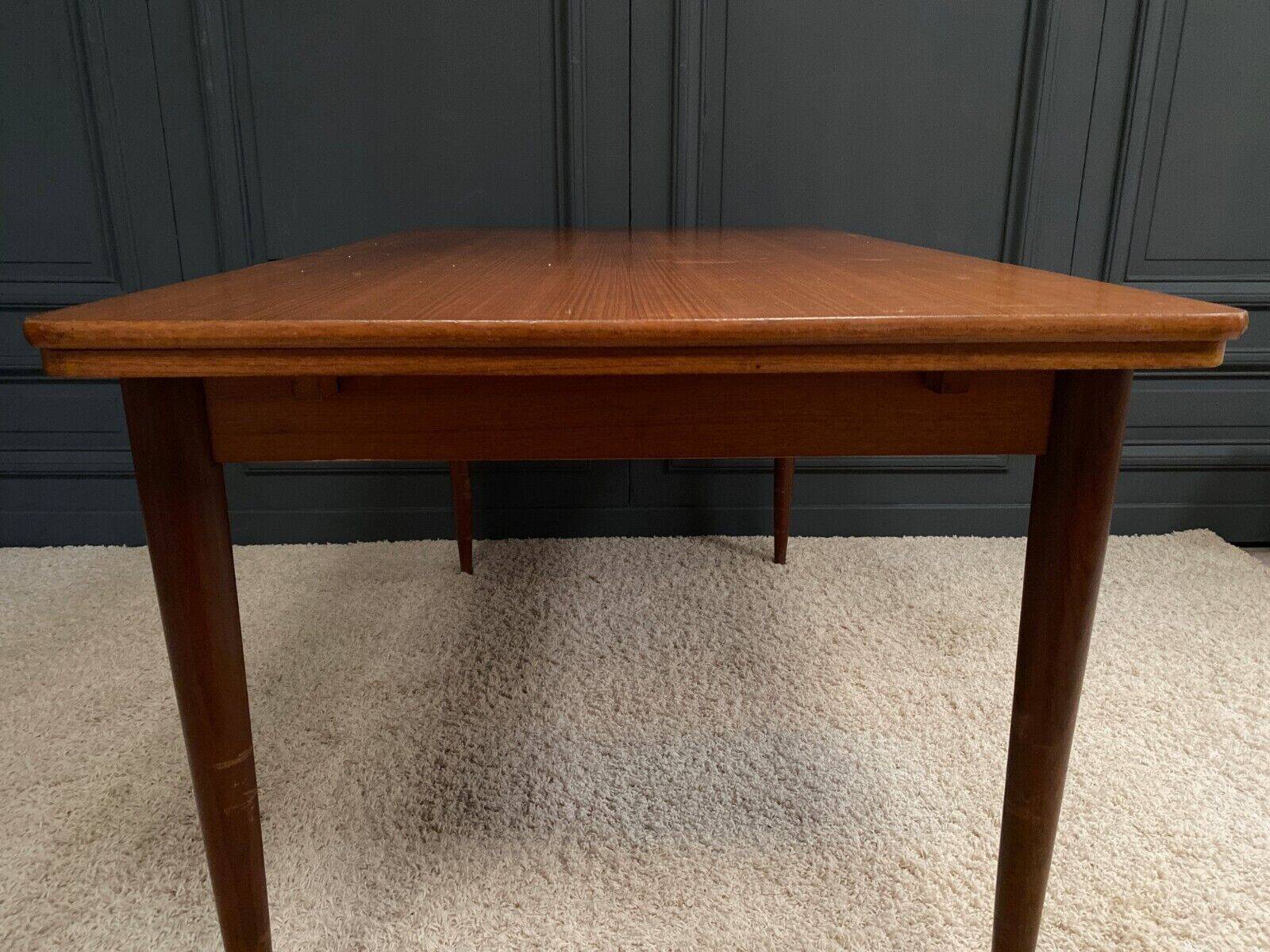 Scandinavian rectangular teak dining table with 4 tapered legs