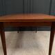 Scandinavian rectangular teak dining table with 4 tapered legs
