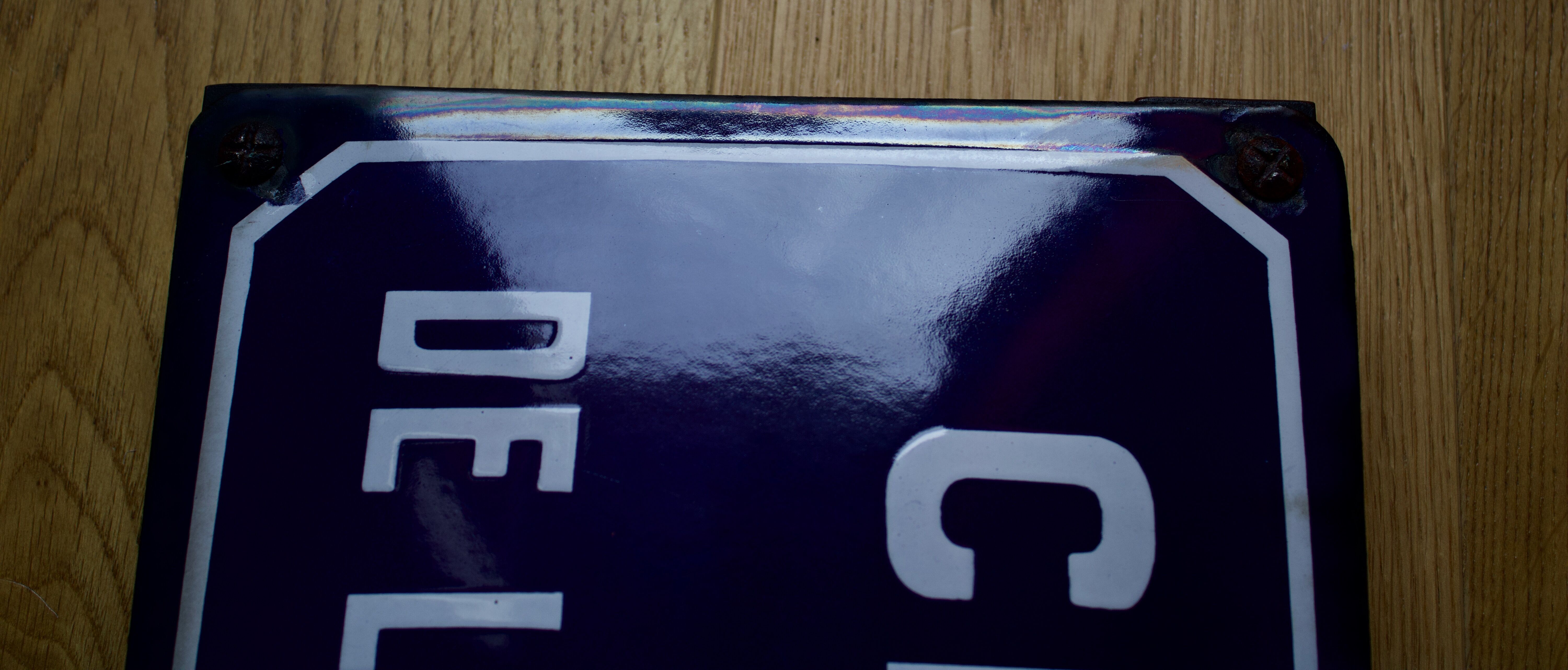 Old Enamelled and bulging "Chemin de la Rente" street plate, in perfect condition, on its cast iron support