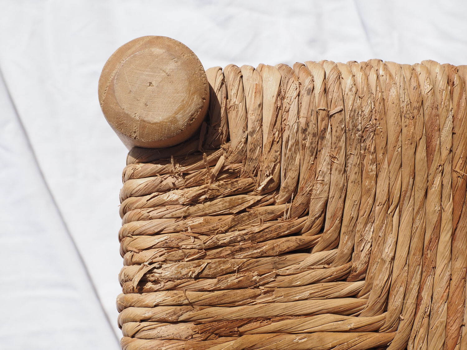 Farm stool made of wood and straw