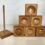 Six wooden egg cups and their Scandinavian style support