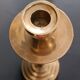 Two vintage wooden and brass candlesticks.