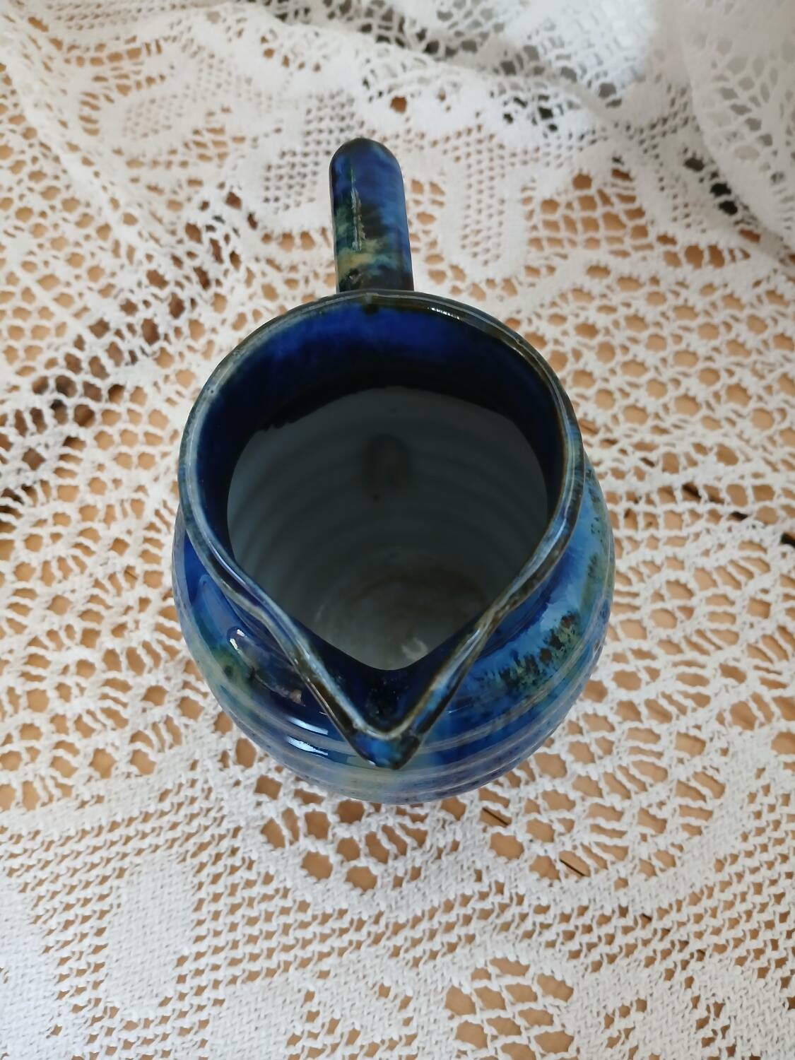 Antique pitcher in enamelled ceramic