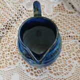Antique pitcher in enamelled ceramic