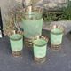 Serve an orangeade, a carafe and 3 glasses in green granite with golden trim.