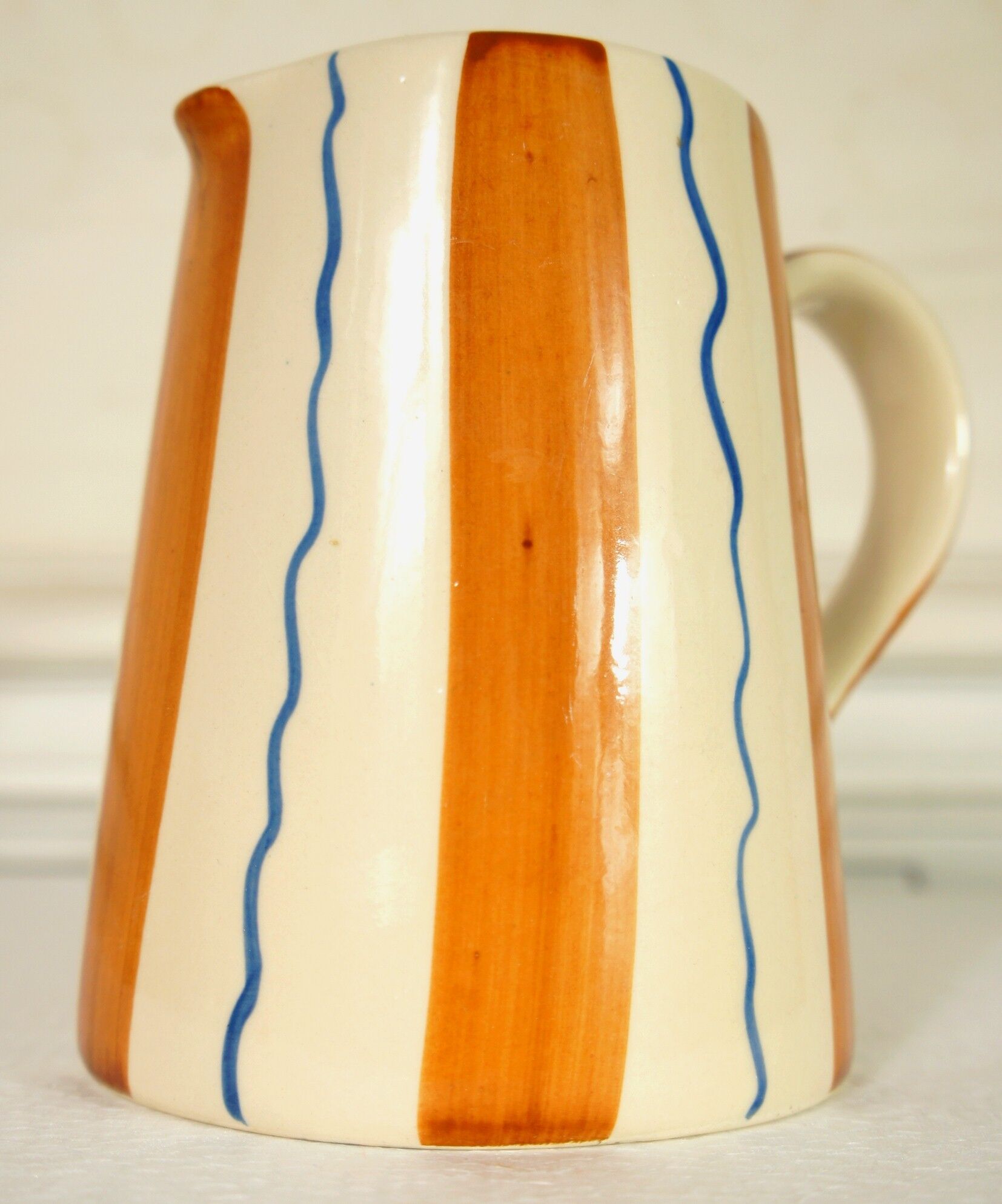 Painted ceramic pitcher