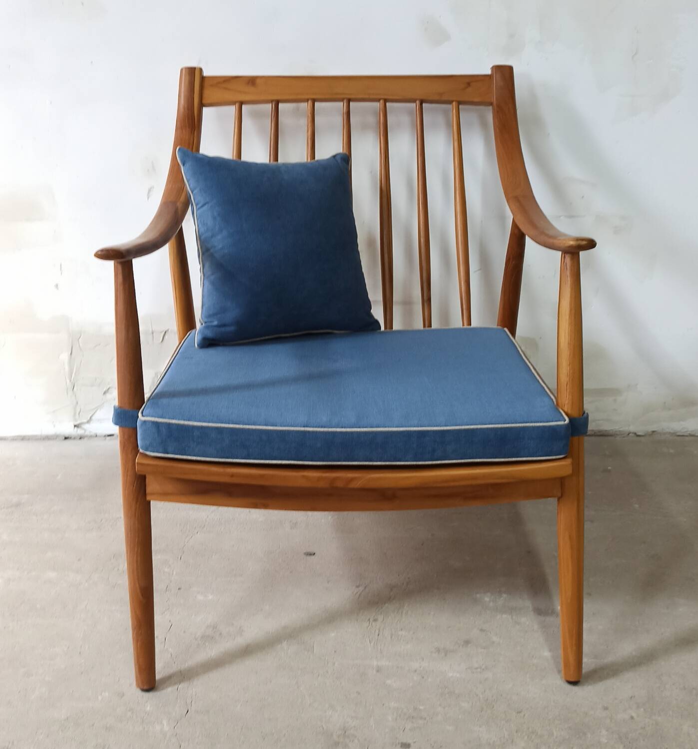Pair of cozy teak armchairs with cushions