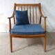 Pair of cozy teak armchairs with cushions
