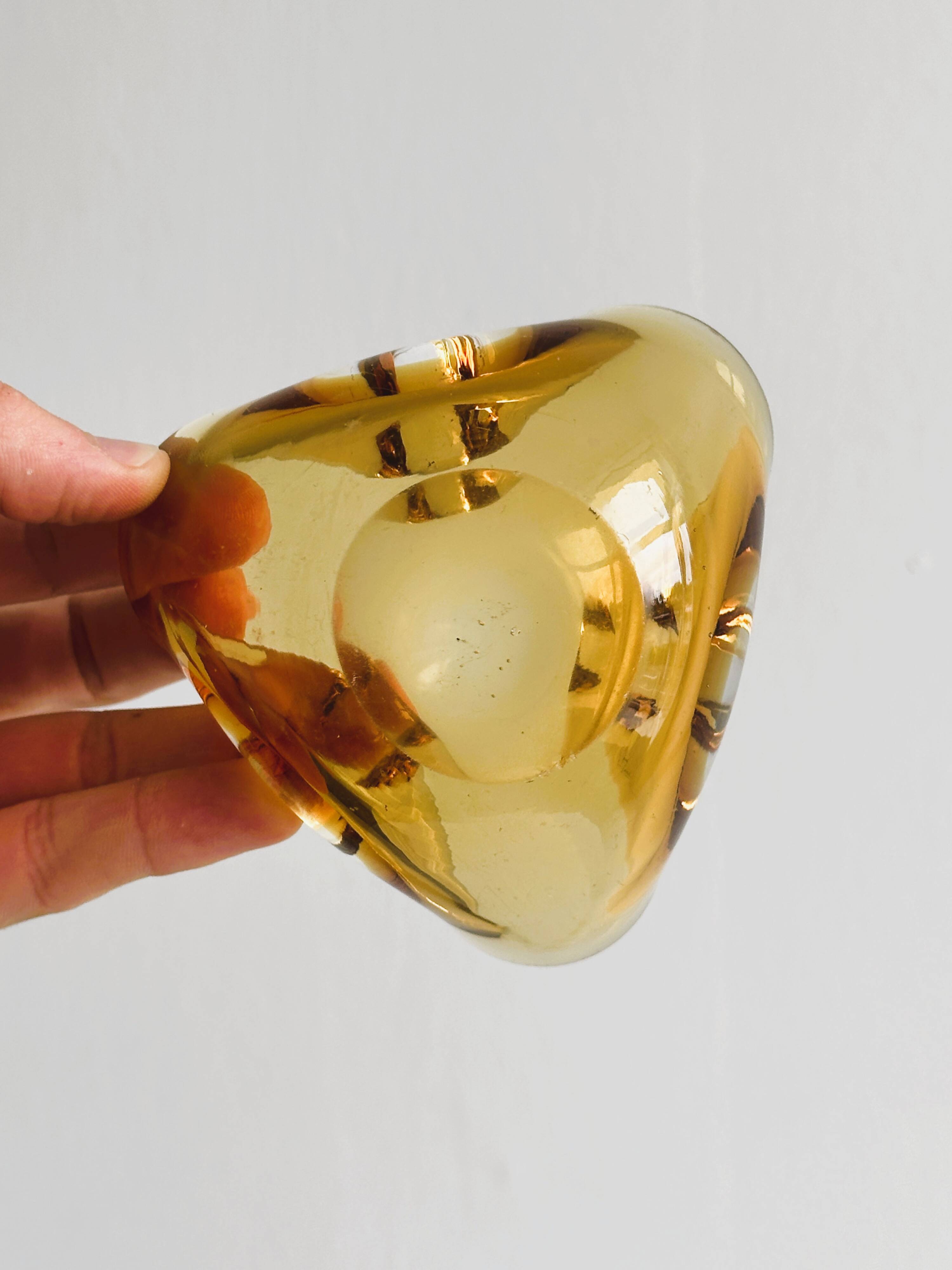 Thick amber yellow glass ashtray