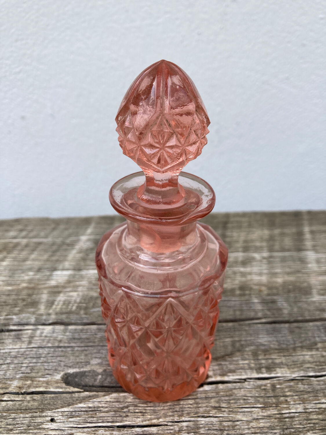 Art Deco perfume bottle in old amber pink glass