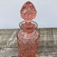 Art Deco perfume bottle in old amber pink glass