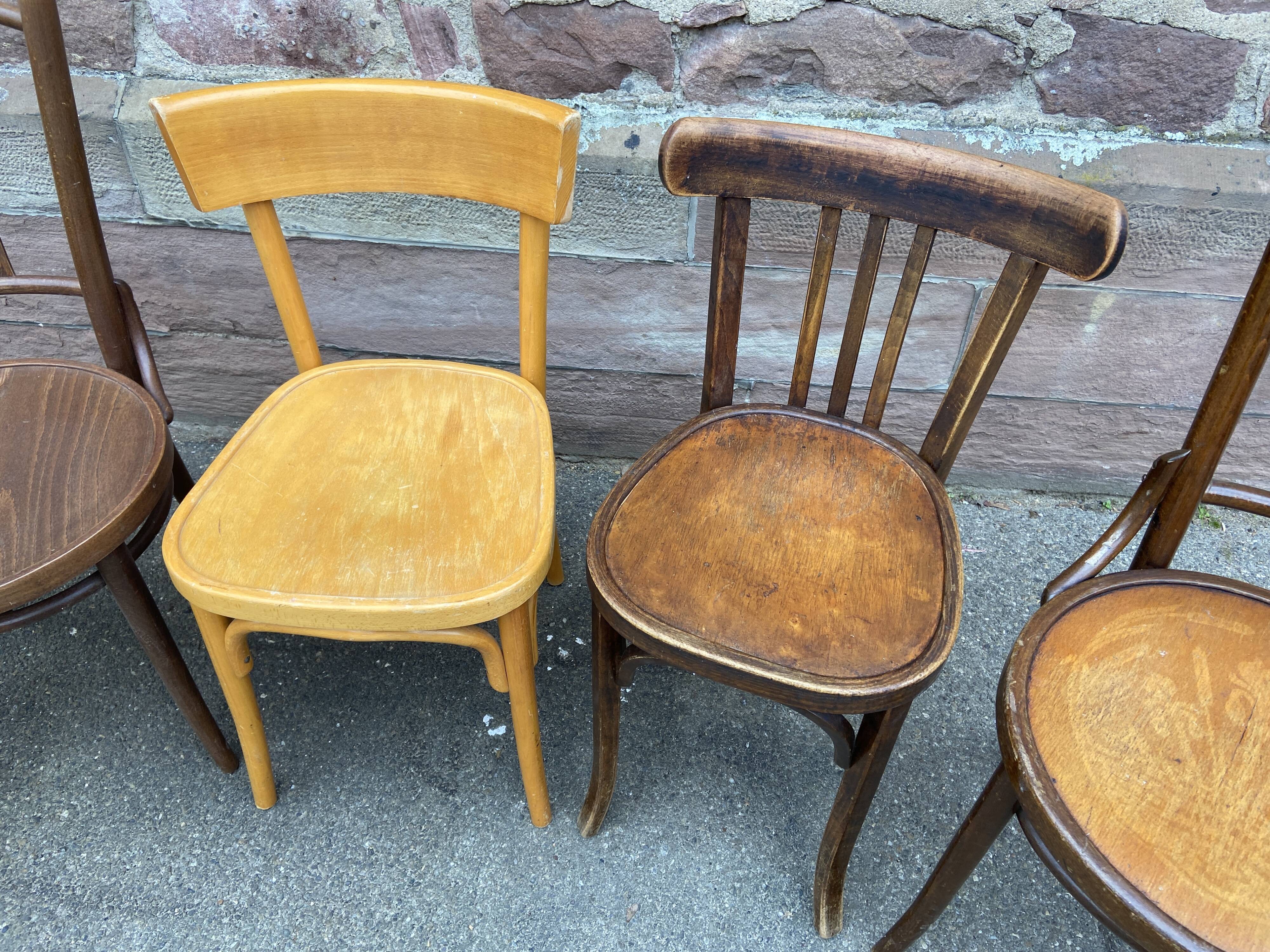 Lot 6 mismatched wooden bistro chairs