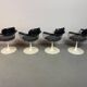 A striking set of four vintage swivel dining chairs