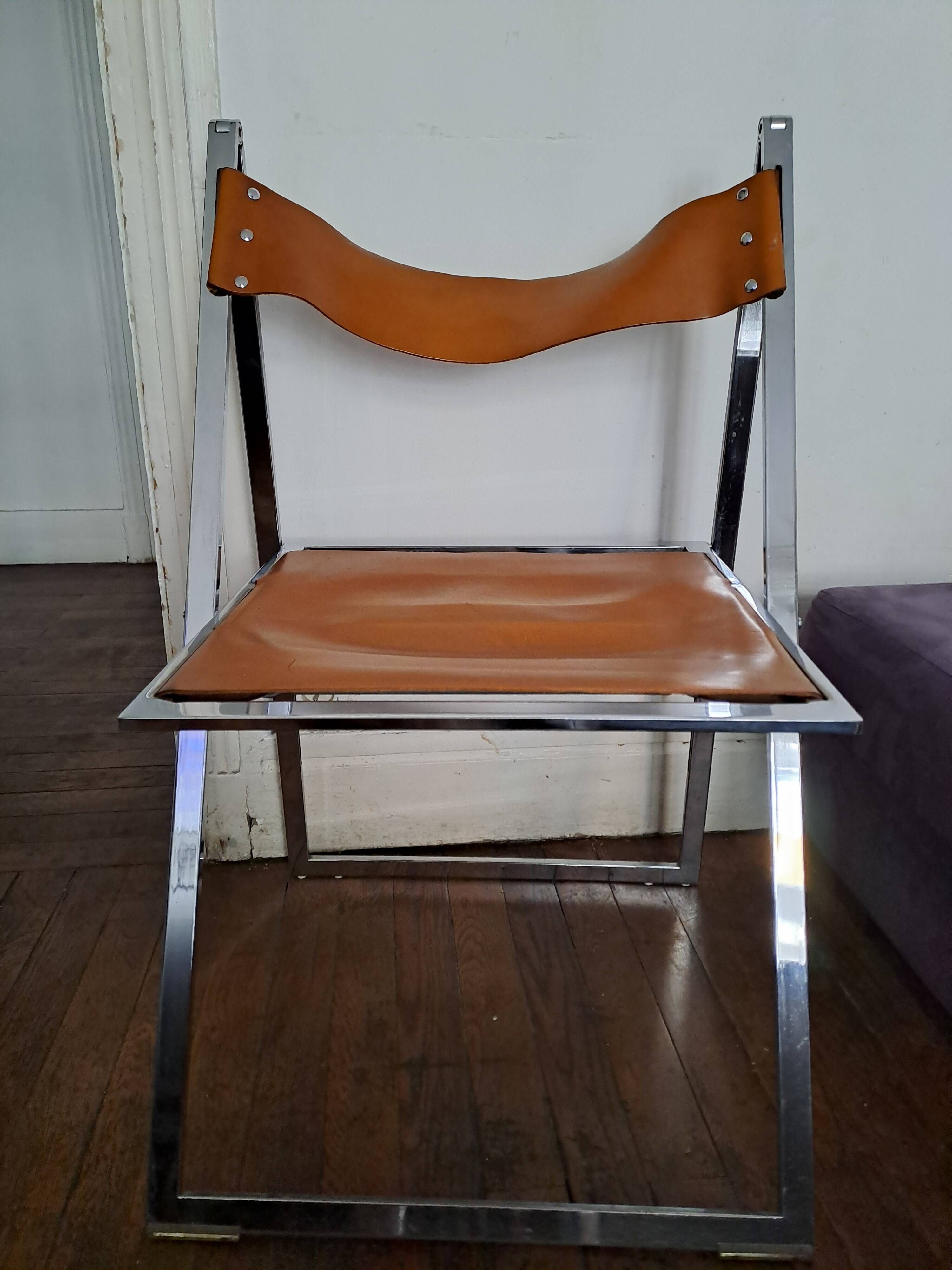 2 Chromed metal and leather folding chairs. 70s. Fontoni & Geraci