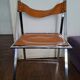 2 Chromed metal and leather folding chairs. 70s. Fontoni & Geraci