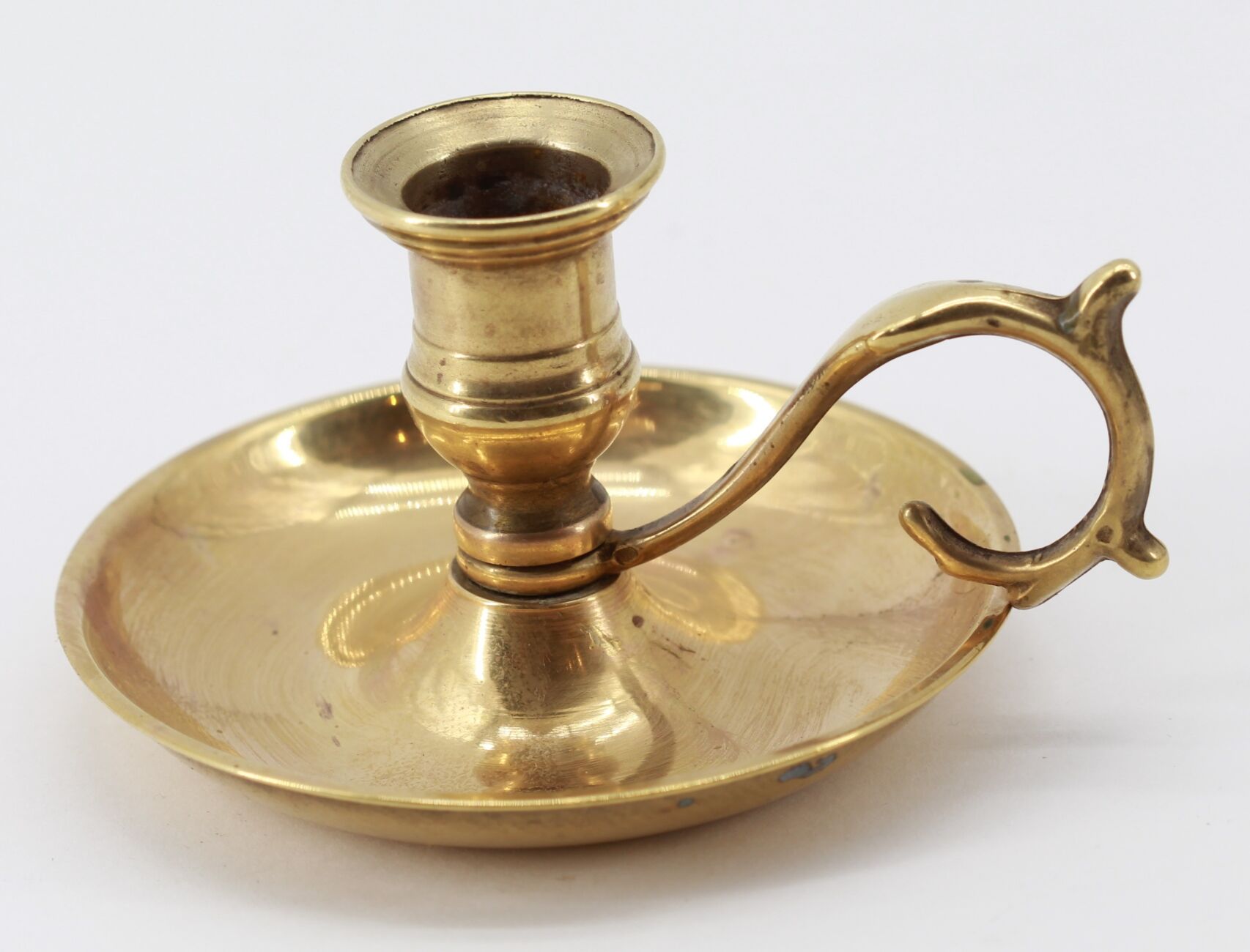 Old brass hand candle holder