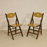 Pair of vintage folding chairs year 50 sculpted backrest.