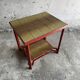Vintage terracotta-red metal side table with glazed brown-green ceramic tile surfaces