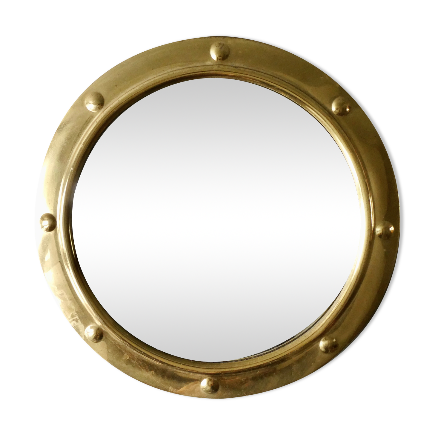 Curved mirror, in a brass porthole, 70s