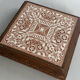 Vintage wooden and antique earthenware trivet, brown tile design