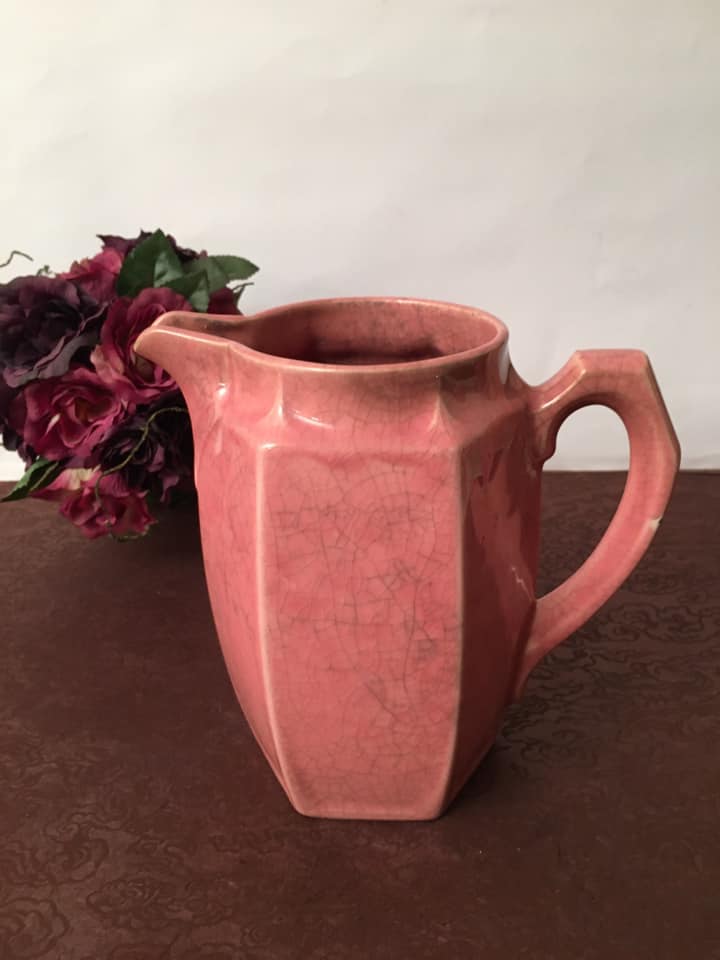 Old pitcher in earthenware of a very pretty pink